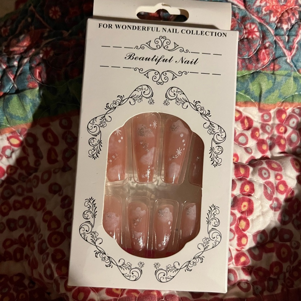 Pink cloud glue on nails